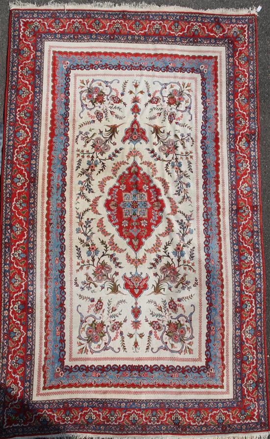 A Persian Tabriz style rug, 9ft 10in by 6ft 1in.
